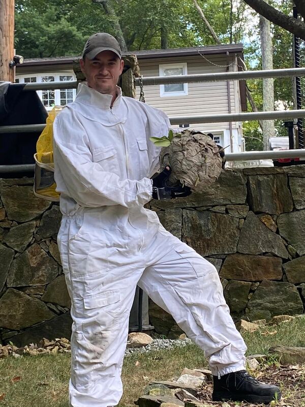 Exterminator Specialist with Beehive. 